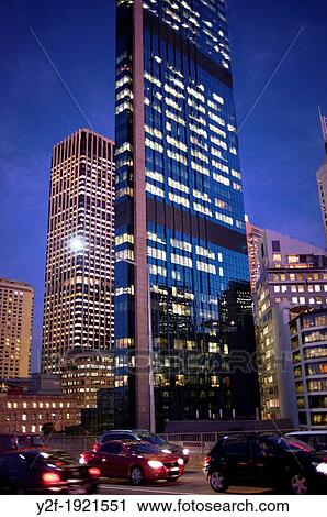 traffic by city buildings at dusk View Large Photo Image Stock Image - traffic by city buildings at dusk. Fotosearch