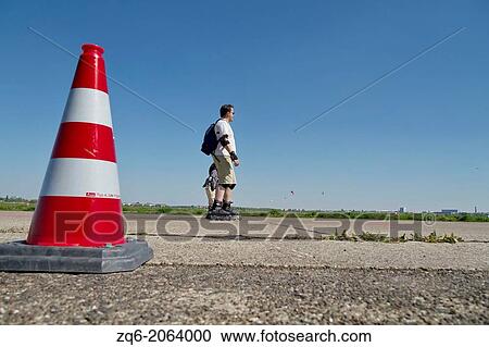 Traffic Cone on the Runway of the former Airport Tempelhof in Berlin, Germany. View Large Photo Image Stock Image - Traffic Cone on the Runway of the former Airport Tempelhof in Berlin, Germany.. Fotosearch
