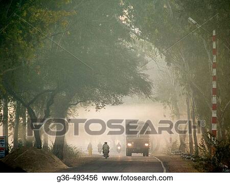 Traffic in fog. Kota, India View Large Photo Image Stock Photograph - Traffic in fog. Kota, India. Fotosearch