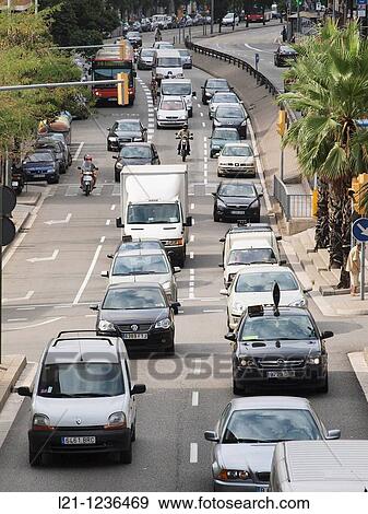 Traffic jam. Cars, trucks and motorcycles in Travessera de Dalt. Gr? cia quarter, Barcelona, Catalonia, Spain. View Large Photo Image Stock Photo - Traffic jam. Cars, trucks and motorcycles in Travessera de Dalt. Gr? cia quarter, Barcelona, Catalonia, Spain.. Fotosearch