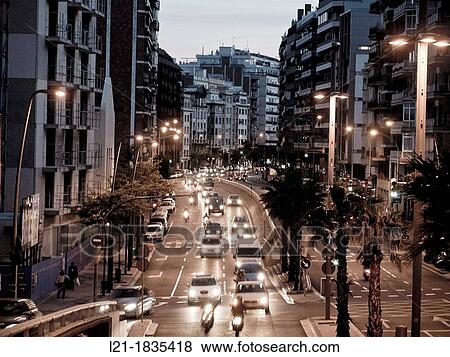 Traffic jam. Cars, trucks and motorcycles at nightfall, night. Travessera de Dalt, Gr? cia quarter, Barcelona, Catalonia, Spain. View Large Photo Image Stock Photo - Traffic jam. Cars, trucks and motorcycles at nightfall, night. Travessera de Dalt, Gr? cia quarter, Barcelona, Catalonia, Spain.. Fotosearch