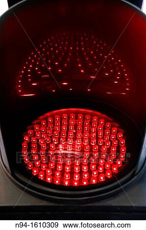 Traffic light of leds red illuminated at night indicating stop to the automobiles. View Large Photo Image Stock Photo - Traffic light of leds red illuminated at night indicating stop to the automobiles.. Fotosearch
