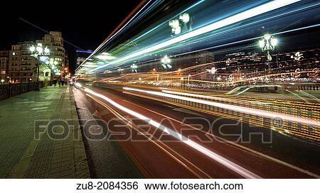 Stock Photograph - Traffic on the bridge of the city hall of Bilbao. Fotosearch