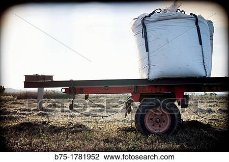 trailer aparcado en el campo cargado con un saco enorme, trailer parked in the field carrying a huge sack, View Large Photo Image Stock Image - trailer aparcado en el campo cargado con un saco enorme, trailer parked in the field carrying a huge sack,. Fotosearch