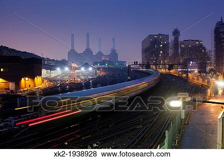 Train and Battersea Power station factory at night, London, UK View Large Photo Image Stock Photo - Train and Battersea Power station factory at night, London, UK. Fotosearch