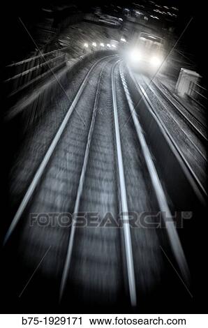 Train and train tracks in the city, DLR, London, England, UK View Large Photo Image Stock Image - Train and train tracks in the city, DLR, London, England, UK. Fotosearch