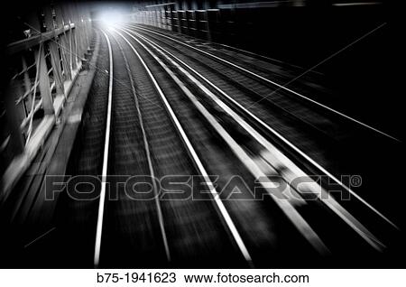 Stock Image - train and train tracks in the city, DLR, London, England, UK. Fotosearch
