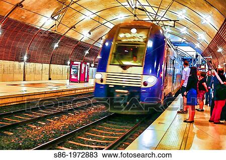 Train Arriving, Passengers Waiting, at the Monte Carlo, Monaco Station. View Large Photo Image Stock Image - Train Arriving, Passengers Waiting, at the Monte Carlo, Monaco Station.. Fotosearch
