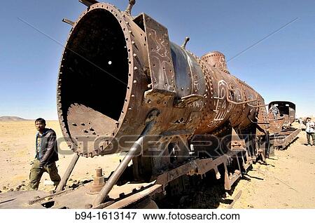 Train cemetery. It is 3 kilometers (1. 9 mi) outside Uyuni, city in the southwest of Bolivia and is connected to it by the old train tracks. Bolivia. View Large Photo Image Stock Photo - Train cemetery. It is 3 kilometers (1. 9 mi) outside Uyuni, city in the southwest of Bolivia and is connected to it by the old train tracks. Bolivia.. Fotosearch