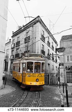 Stock Image - Train in Alfama. Lisbon. Portugal.. Fotosearch