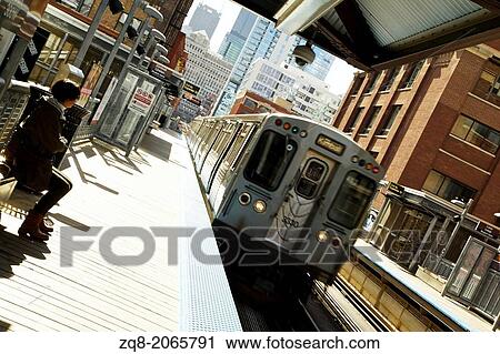 Train moving on the tracks at CTA Station in Chicago. View Large Photo Image Stock Image - Train moving on the tracks at CTA Station in Chicago.. Fotosearch