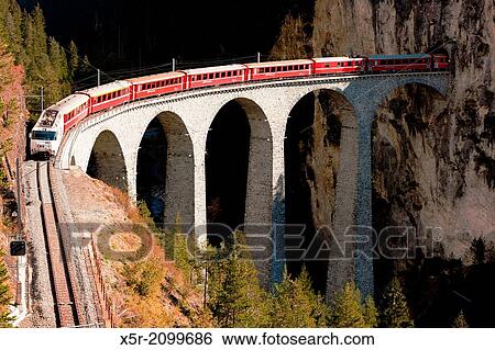 train on Rhaetian Railway, Landwasserviadukt, canton Graubunden, Switzerland. View Large Photo Image Stock Photograph - train on Rhaetian Railway, Landwasserviadukt, canton Graubunden, Switzerland.. Fotosearch