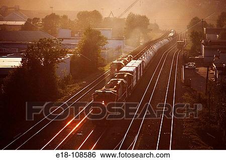 Train on tracks running, North Vancouver. British Columbia, Canada View Large Photo Image Stock Photograph - Train on tracks running, North Vancouver. British Columbia, Canada. Fotosearch