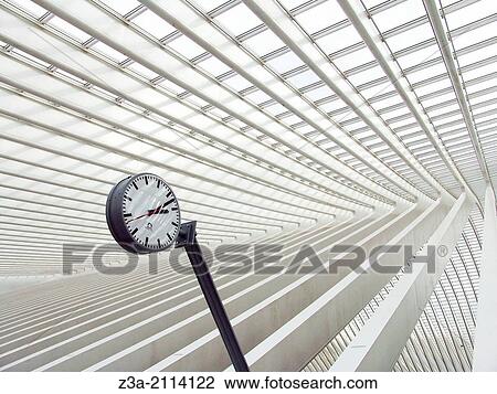 Stock Image - Trainstation clock at Liege Station, Station Liege-Guillemins, Liege, Belgium, Europe.. Fotosearch