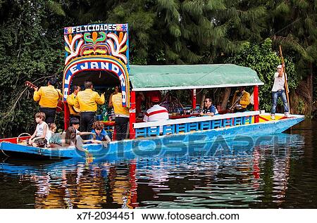 Trajineras on Canal, Xochimilco, Mexico City, Mexico. View Large Photo Image Stock Image - Trajineras on Canal, Xochimilco, Mexico City, Mexico.. Fotosearch