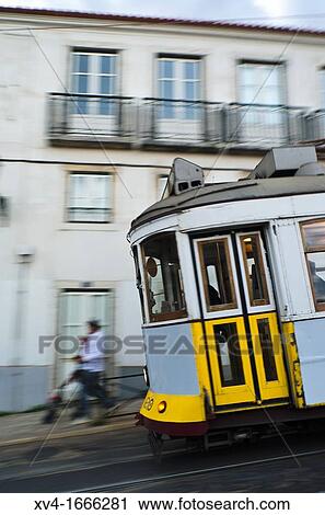 Tram crossing Largo Das Portas Do Sol, Alfama district in Lisbon, Portugal View Large Photo Image Stock Image - Tram crossing Largo Das Portas Do Sol, Alfama district in Lisbon, Portugal. Fotosearch