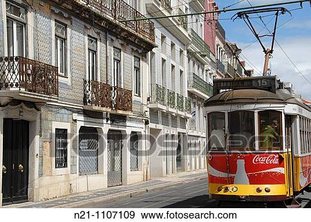 Tram going along the Rua da Junqueira, Santo Amaro, Lisbon, Portugal View Large Photo Image Stock Photo - Tram going along the Rua da Junqueira, Santo Amaro, Lisbon, Portugal. Fotosearch