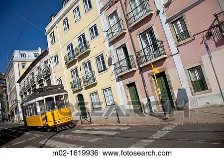 Tram in a street in Alfama district, Lisbon, Portugal, Europe View Large Photo Image Stock Photograph - Tram in a street in Alfama district, Lisbon, Portugal, Europe. Fotosearch