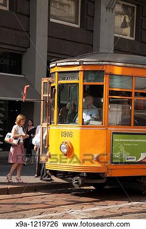Tram in Alessandro Manzoni Street in Milan, Italy View Large Photo Image Stock Photograph - Tram in Alessandro Manzoni Street in Milan, Italy. Fotosearch