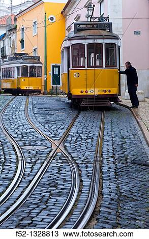 Tram on Rua de Sao Tome, Alfama district, Lisbon, Portugal View Large Photo Image Stock Image - Tram on Rua de Sao Tome, Alfama district, Lisbon, Portugal. Fotosearch