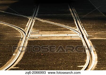 Stock Image - Tram Rail Tracks with Frontlighting in Berlin, Germany.. Fotosearch