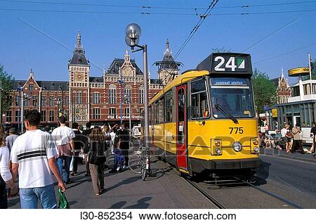 Tramway in front of the central train station built in the late 19th century, Amsterdam, The Netherlands View Large Photo Image Picture - Tramway in front of the central train station built in the late 19th century, Amsterdam, The Netherlands. Fotosearch