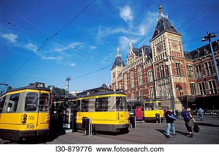 Tramway in front of the central train station built in the late 19th century, Amsterdam, The Netherlands View Large Photo Image Stock Photograph - Tramway in front of the central train station built in the late 19th century, Amsterdam, The Netherlands. Fotosearch