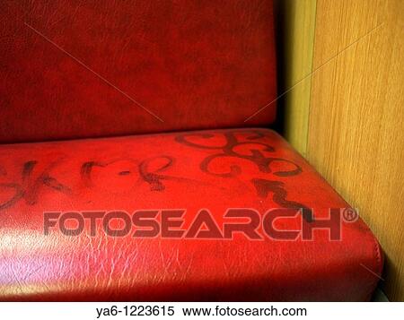 Stock Photography - Tramway seat with graffiti. Fotosearch