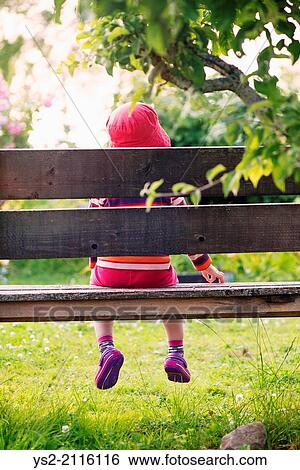 Tranquil summer scene. Young girl sitting alone in garden, watching plants and flowers. View Large Photo Image Stock Photograph - Tranquil summer scene. Young girl sitting alone in garden, watching plants and flowers.. Fotosearch