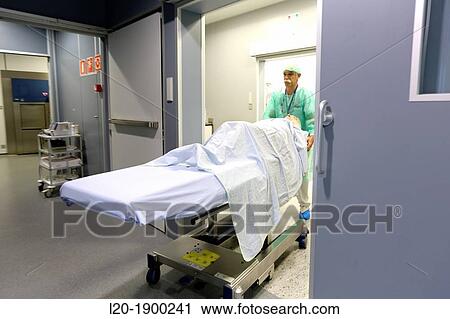 Stock Image - transferring patient, Surgery, Operating room, Onkologikoa Hospital, Oncology Institute, Case Center for prevention, diagnosis and treatment of cancer, Donostia, San Sebastian, Gipuzkoa, Basque Country, Spain. Fotosearch