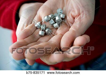 Stock Image - Transistors. Semiconductor device commonly used to amplify or switch electronic signals.. Fotosearch
