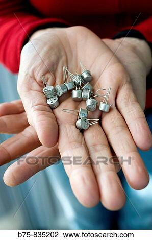 Stock Image - Transistors. Semiconductor device commonly used to amplify or switch electronic signals.. Fotosearch