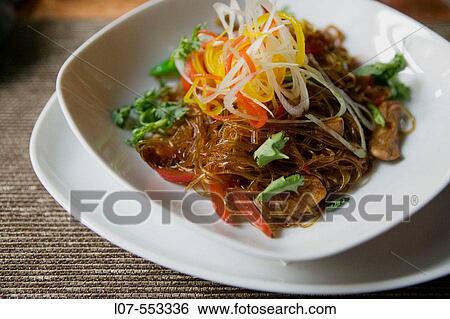 Transparent chinese noodles with shredded vegetables and mushrooms in fancy restaurant. St Petersburg. Russia View Large Photo Image Stock Photograph - Transparent chinese noodles with shredded vegetables and mushrooms in fancy restaurant. St Petersburg. Russia. Fotosearch