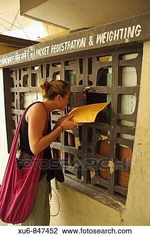 Traveler sending a parcel from the Kathmandu Post office Nepal View Large Photo Image Stock Image - Traveler sending a parcel from the Kathmandu Post office Nepal. Fotosearch