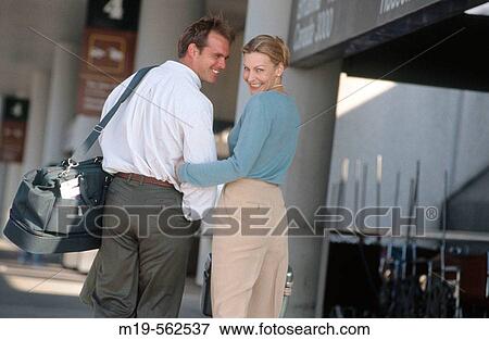 traveling couple at an airport View Large Photo Image Stock Photo - traveling couple at an airport. Fotosearch
