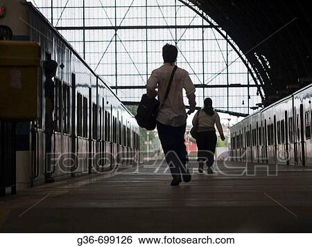 Stock Photograph - Travellers in main train station in Buenos Aires, Argentina. Fotosearch