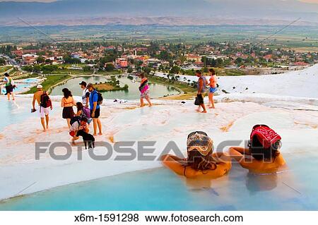 Travertine terrace formations and tourists Pamukkale Denizli province Anatolia Turkey View Large Photo Image Stock Photo - Travertine terrace formations and tourists Pamukkale Denizli province Anatolia Turkey. Fotosearch