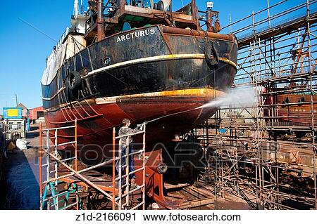 Trawler on the slipways, in repair yards at Peterhead Harbour Scotland UK. View Large Photo Image Stock Image - Trawler on the slipways, in repair yards at Peterhead Harbour Scotland UK.. Fotosearch