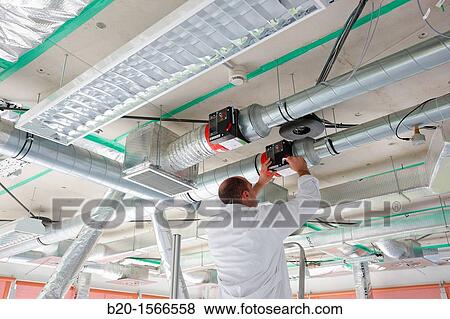 Stock Photo - Treatment system air conditioning, Kubik, Experimental laboratory R & D for the development of new concepts, products and services to improve energy efficiency in buildings, Intelligent management of HVAC and lighting systems and renewable energy supply. Fotosearch