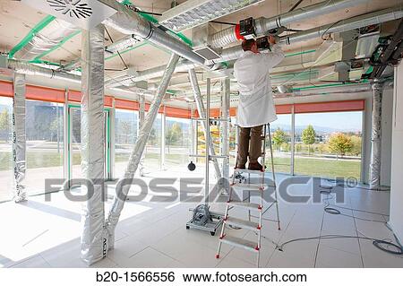 Treatment system air conditioning, Kubik, Experimental laboratory R & D for the development of new concepts, products and services to improve energy efficiency in buildings, Intelligent management of HVAC and lighting systems and renewable energy supply View Large Photo Image Stock Photograph - Treatment system air conditioning, Kubik, Experimental laboratory R & D for the development of new concepts, products and services to improve energy efficiency in buildings, Intelligent management of HVAC and lighting systems and renewable energy supply. Fotosearch