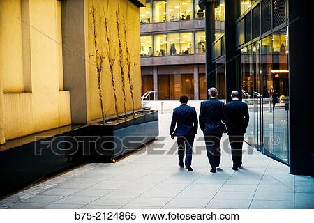 tree unrecognizable and relaxed executive walking down in the street in London, England, UK, Europe View Large Photo Image Stock Photography - tree unrecognizable and relaxed executive walking down in the street in London, England, UK, Europe. Fotosearch