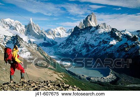 Trekker, Cerro Torre and Fitz Roy in background. Los Glaciares National Park. Patagonia. Argentina View Large Photo Image Stock Photography - Trekker, Cerro Torre and Fitz Roy in background. Los Glaciares National Park. Patagonia. Argentina. Fotosearch