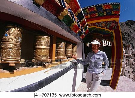 Trekker spinning prayer wheels, Rizong gompa, near Leh, Ladakh View Large Photo Image Stock Photography - Trekker spinning prayer wheels, Rizong gompa, near Leh, Ladakh. Fotosearch