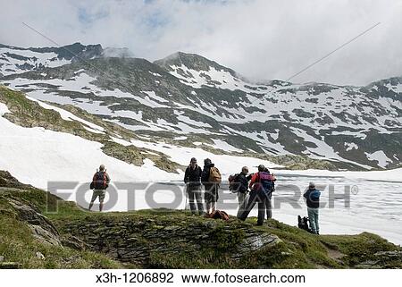 trekkers by the Scuro lake, Val Piora, Canton Ticino, Switzerland, Europe View Large Photo Image Stock Image - trekkers by the Scuro lake, Val Piora, Canton Ticino, Switzerland, Europe. Fotosearch
