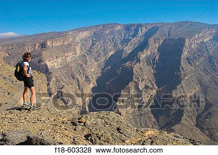 Trekking to an abandoned village above the? Grand Canyon?, Jebel Shams, Western Hajar mountains (Al Hajar al Gharbi), nothern Oman View Large Photo Image Stock Photo - Trekking to an abandoned village above the? Grand Canyon?, Jebel Shams, Western Hajar mountains (Al Hajar al Gharbi), nothern Oman. Fotosearch