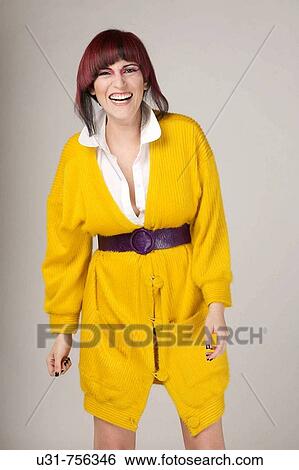 Trendy colorful girl smiling at the camera View Large Photo Image Stock Photograph - Trendy colorful girl smiling at the camera. Fotosearch