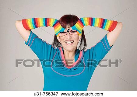 Stock Photo - Trendy colorful girl using her hands to simulate glasses. Fotosearch