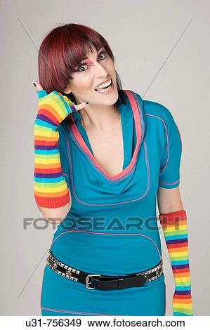 Stock Photo - Trendy girl making a gesture as if she is talking on the phone. Fotosearch