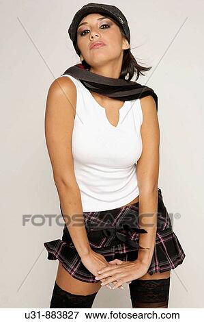 Stock Photo - Trendy model posing in a studio setting. Fotosearch
