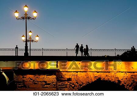 Stock Image - Triana bridge at night. Seville. Andalucia. Spain.. Fotosearch